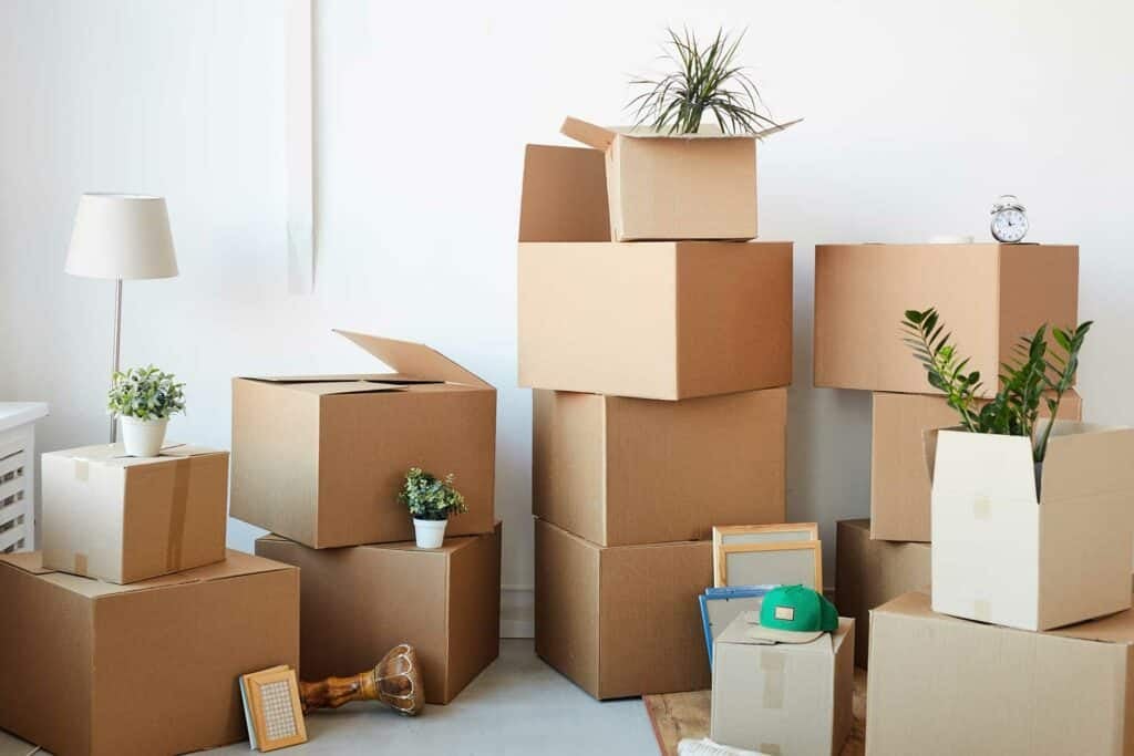 Stacked storage boxes protecting household items and fragile belongings.