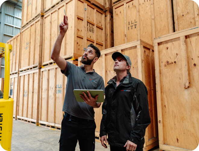 Team members inspecting business storage containers