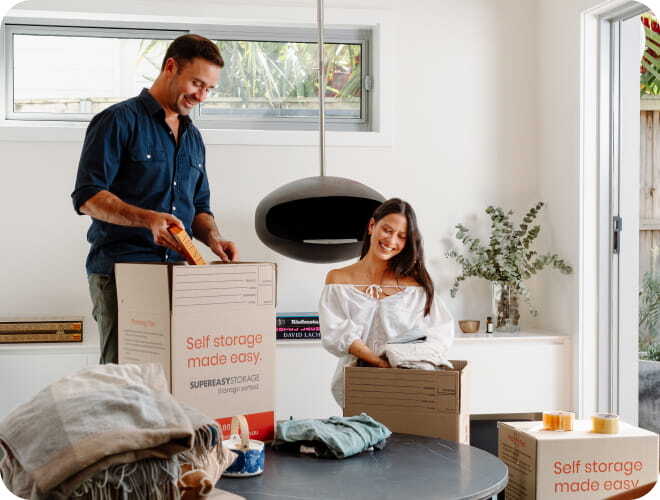 Customer packing boxes at home for self-storage
